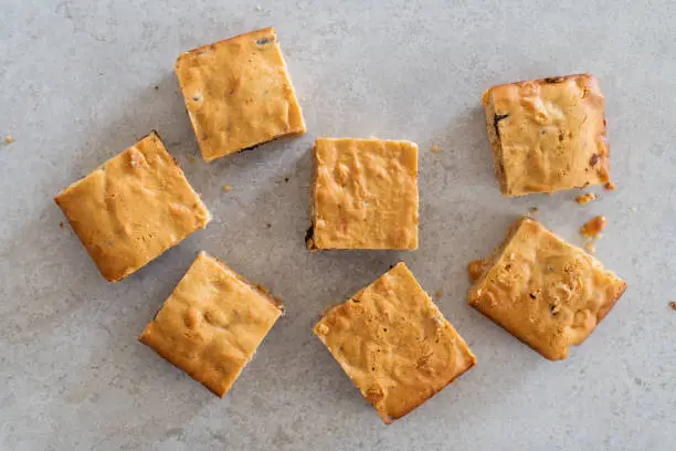 Blondie brownies with peanut butter and white chocolate. Homemade, delicious dessert.