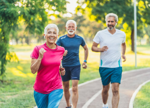 istock Senior athletes jogging in the park 1183712174