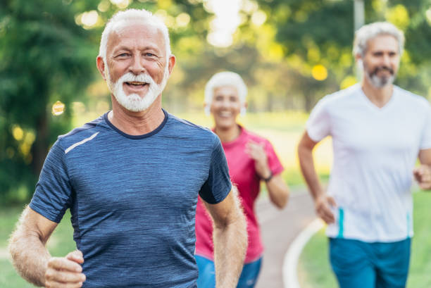 istock Senior athletes jogging in the park 1183712177