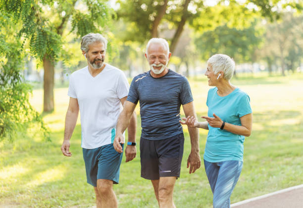 istock Senior friends jogging in the park 1183712180