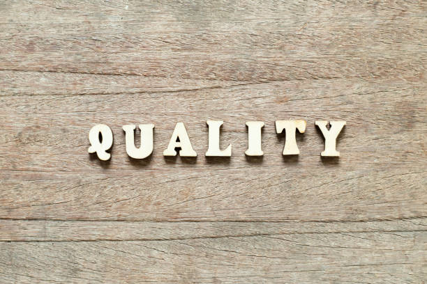 istock Letter block in word quality on wood background 1183715751