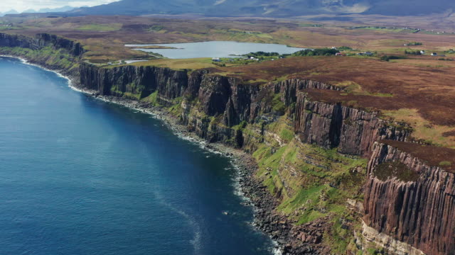 AERIAL: Tracking shot of Kilt Rock from the Sea, Isle of Skye