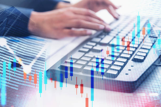 istock Woman typing on keyboard, graphs 1183717630