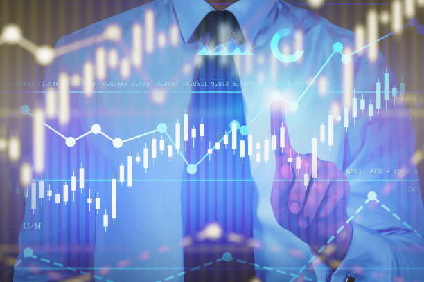 istock Businessman in tie working with digital charts 1183718257