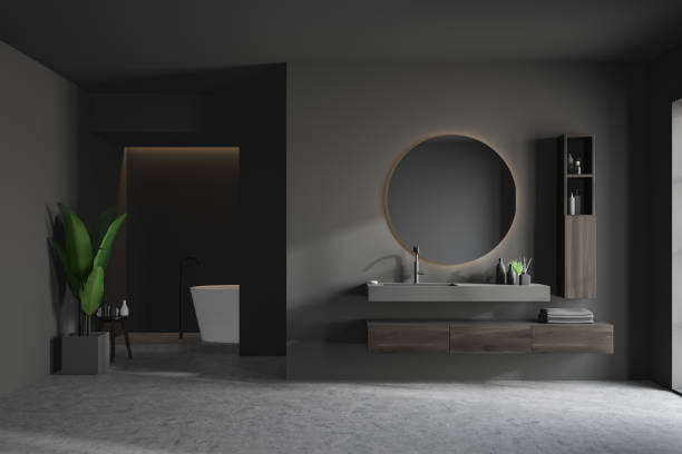 istock Gray bathroom interior with tub and sink 1183718473