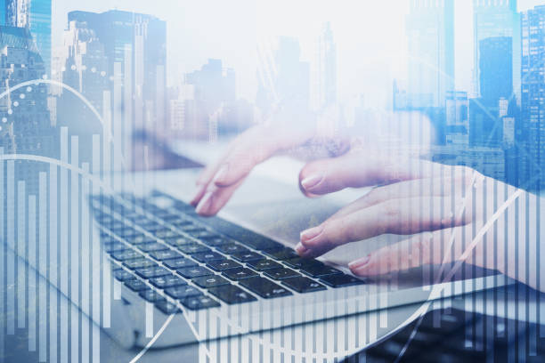 istock Woman typing in city, graph 1183718819