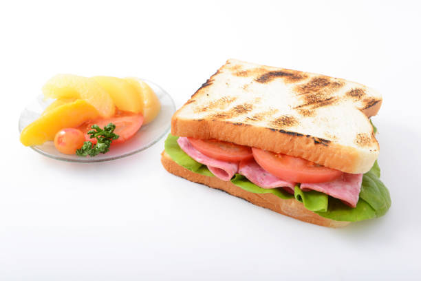 Fresh and tasty sandwich and fruits