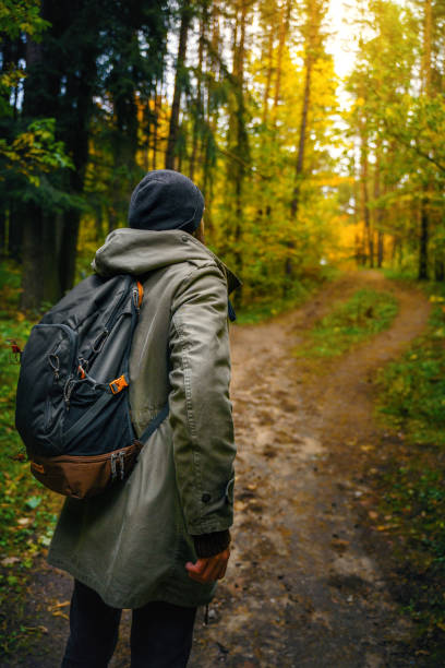istock Man hiking in the autumn forest. 1183722568
