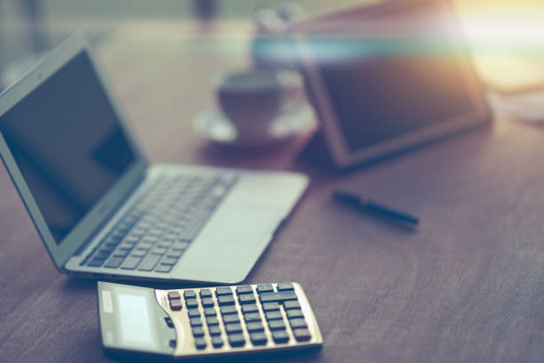 istock calculator and laptop on working desk 1183723164