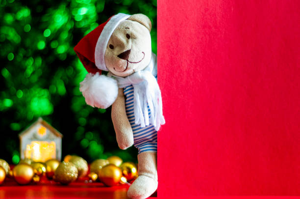 istock Santa Claus teddy bear with empty red card. 1183725830