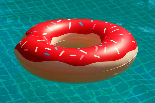 istock Inflatable swim ring in shape of donut 1183727163