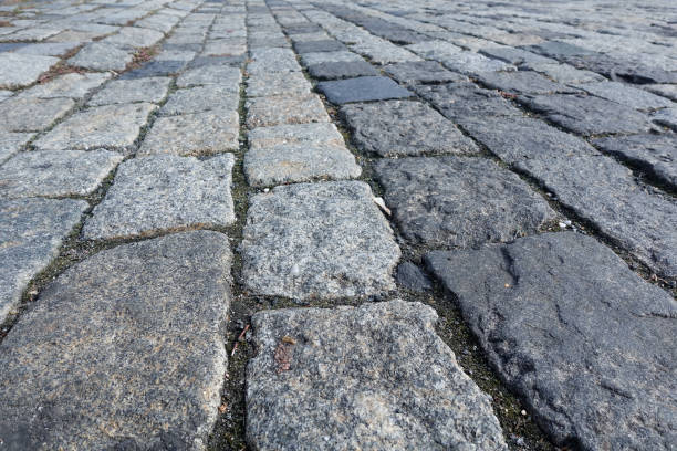 istock Large stones of a cobblestone paved bridge. Close-up 1183727721