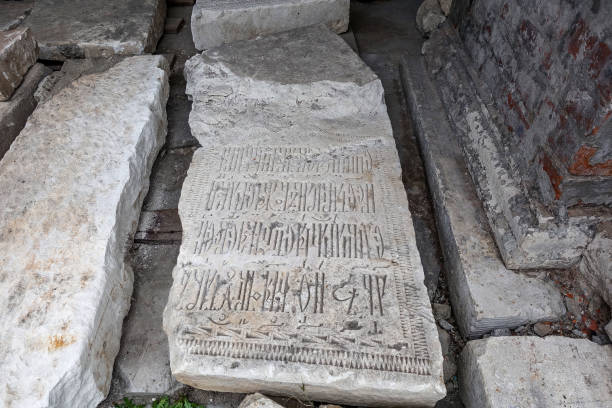 istock Archaeological excavations. Old stone slabs with old Slavonic inscriptions. 1183727974