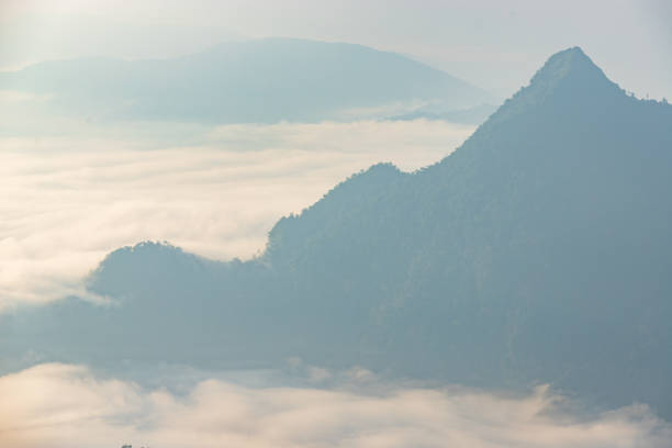 istock Sun rises Mountain at phu chi fa cliff chiang rai Thailand. 1183730590