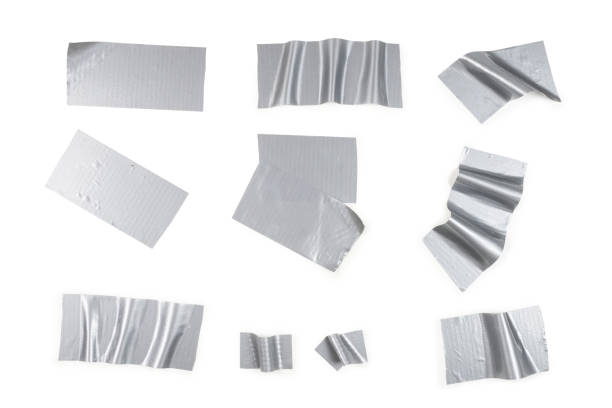 istock Silver scotch tape pieces isolated on white background. 1183733352
