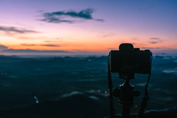 istock Morning Sunlight and camera on tripod 1183737903