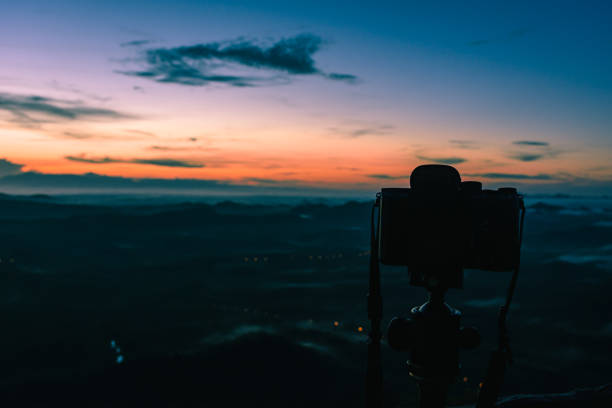 istock Morning Sunlight and camera on tripod 1183737920