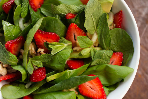 istock salad with nuts and strawberries 1183741415