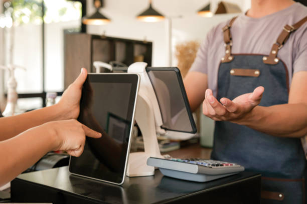 istock Barista is using the screen to receive orders from customers. 1183742072