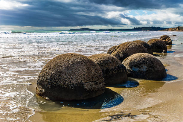 istock Row of huge round boulders 1183744374