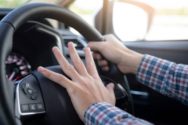 istock The hand of a good driver is testing the car horn. 1183745197