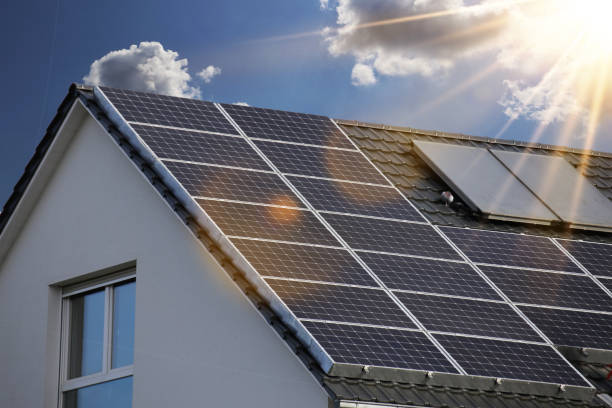 roof with solar panels (photovoltaics) - solar panels house imagens e fotografias de stock