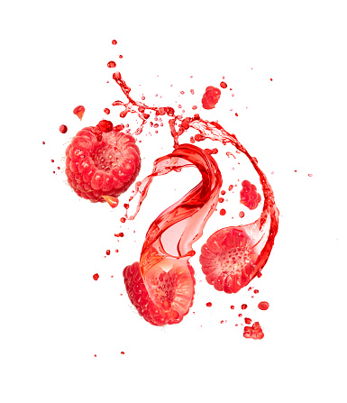 Juice splashes out from cutted raspberries on a white background