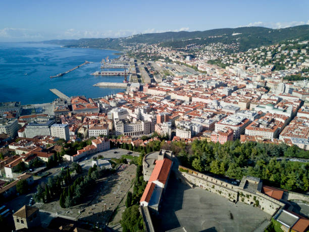 Aerial video shooting with drone on Trieste Aerial video shooting with drone on Trieste, a famous Italy city, important hub of maritime trade and tourist art trieste stock pictures, royalty-free photos & images