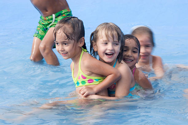 istock Happy children in swimming pool 118375000