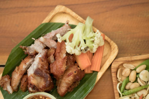 istock Fried pork rib, deep fried fried pork rib or fried pork served on banana leaf 1183750653
