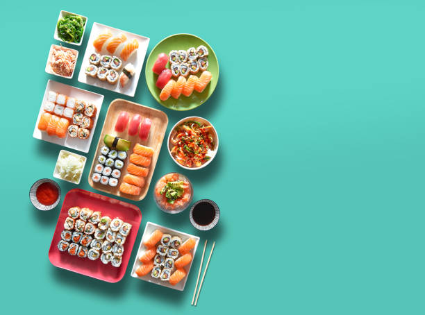 assortment of trays and plate of sushi and maki - sushi food vegetarian food japanese cuisine imagens e fotografias de stock