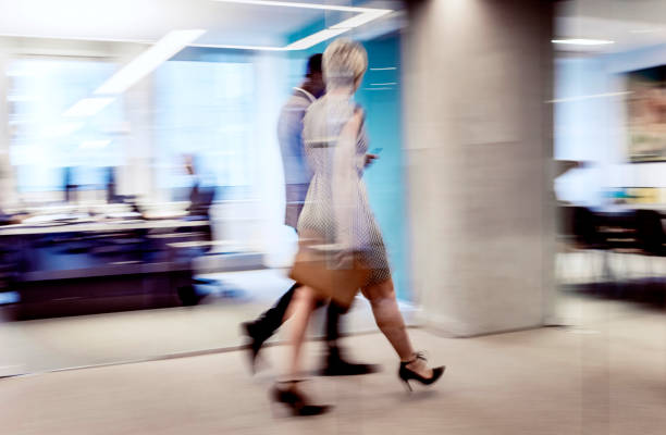 istock Business People Walking Across the Corridor, Blurred Motion 1183756033