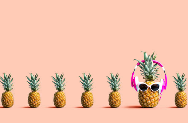 istock One out unique pineapple wearing headphones 1183761540