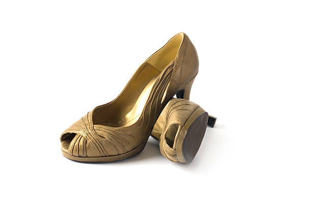 istock Gold ladies high heeled shoes 118376167