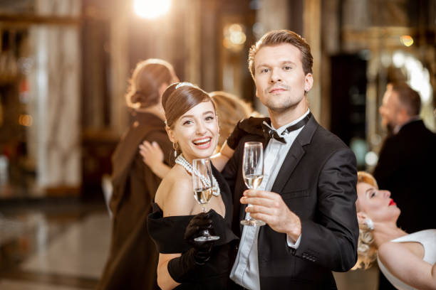 Portrait of an elegant couple strictly dressed dancing at the luxury restaurant during the grand celebration