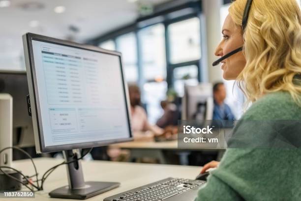 Woman Working In A Call Centre Stock Photo - Download Image Now - Customer Service Representative, Call Center, Service