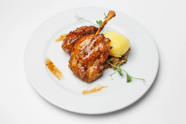 istock baked chicken leg with a potato 1183762895