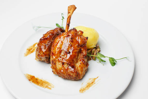 istock baked chicken leg with a potato 1183763024