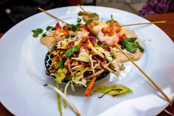 istock Asian grilled shrimps with vegetable slad. 1183764288