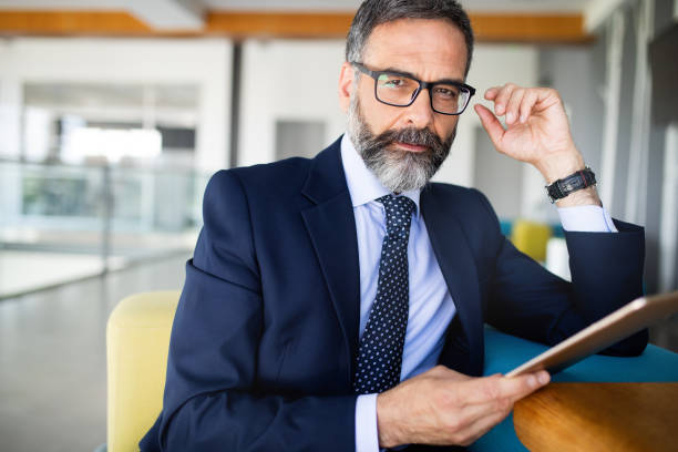 istock Confident senior businessman leader working in office 1183764775