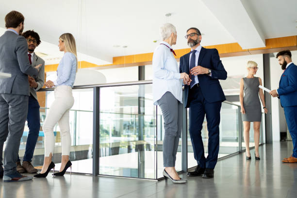 istock Group of perspective designers discussing in front of office 1183764824