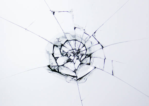 istock Broken glass protective glass against impact. Cracks and lines isolated on white background. Cracked tempered, laminated and heat-strengthened glass to protect your phone screen. 1183765618
