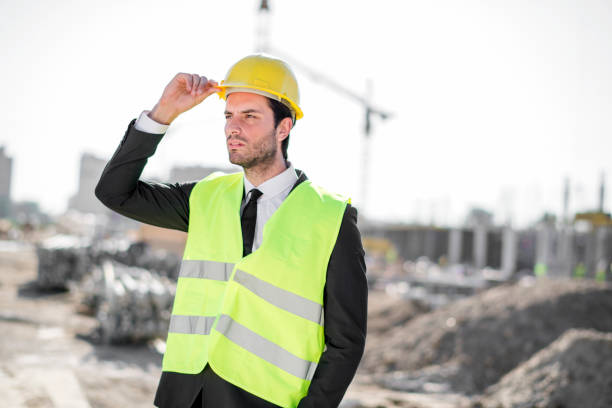 istock Professional engineer architect worker with protective helmet and blueprints paper construction site 1183768602