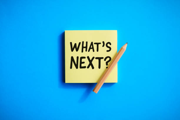 What’s next ? concepts with text on notepaper and pencil.