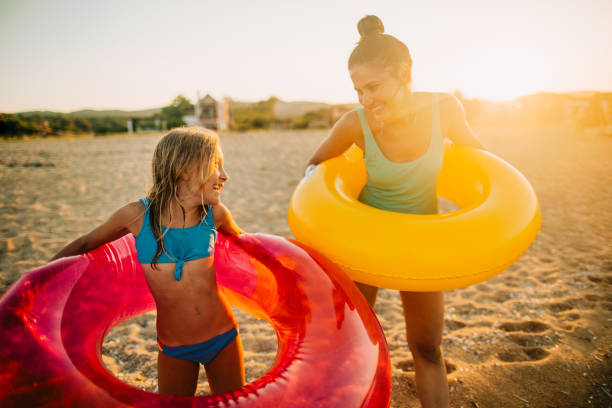 istock With mommy at the beach 1183774490