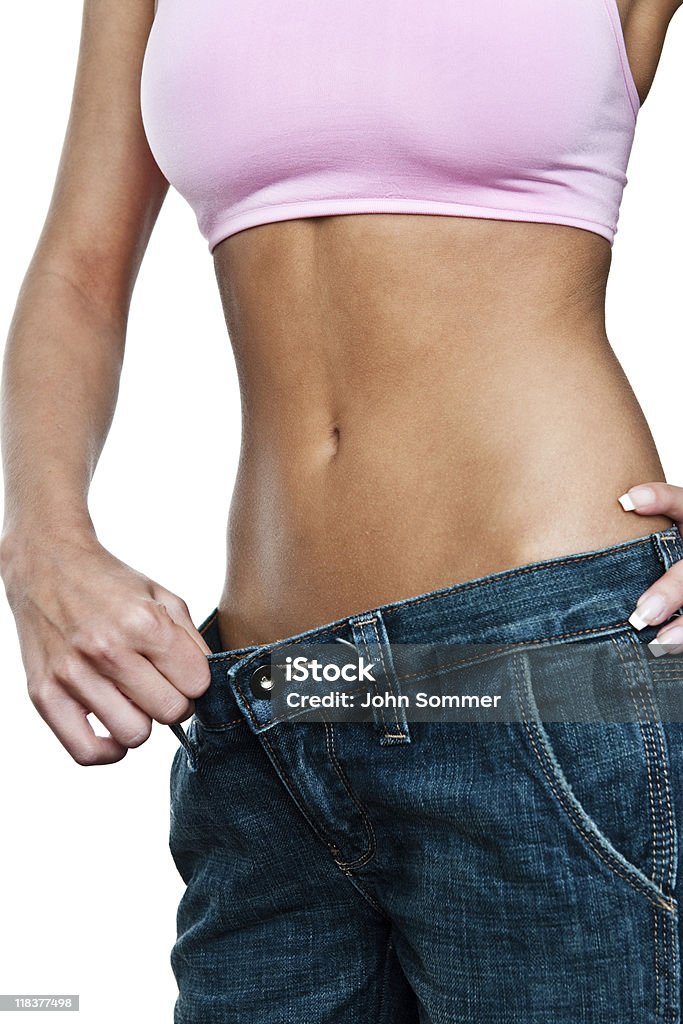 Frau zeigt ihre Gewichtsverlust - Lizenzfrei Abnehmen Stock-Foto