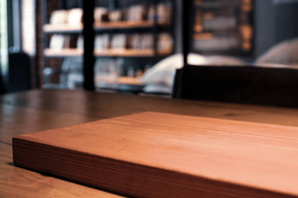 wooden table empty of display in cafe with luxury light decoration for dinner celebration