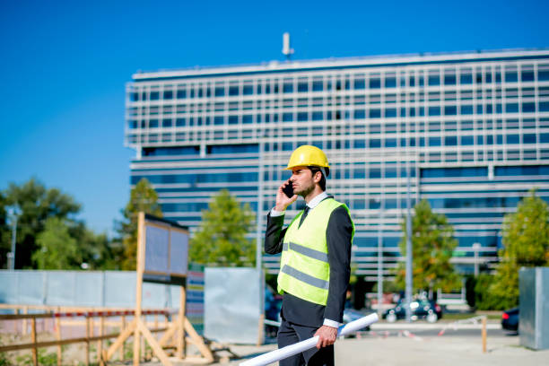 istock Professional engineer architect worker with protective helmet and blueprints paper construction site 1183775903