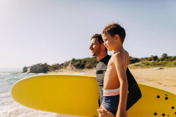 istock Surfers at the beach 1183776735