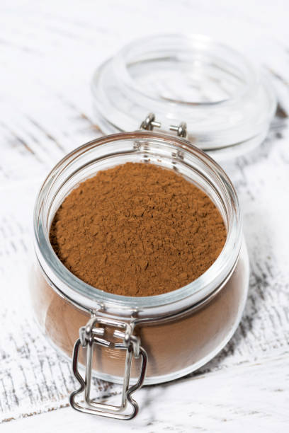istock cocoa powder in a glass jar, top view 1183776933